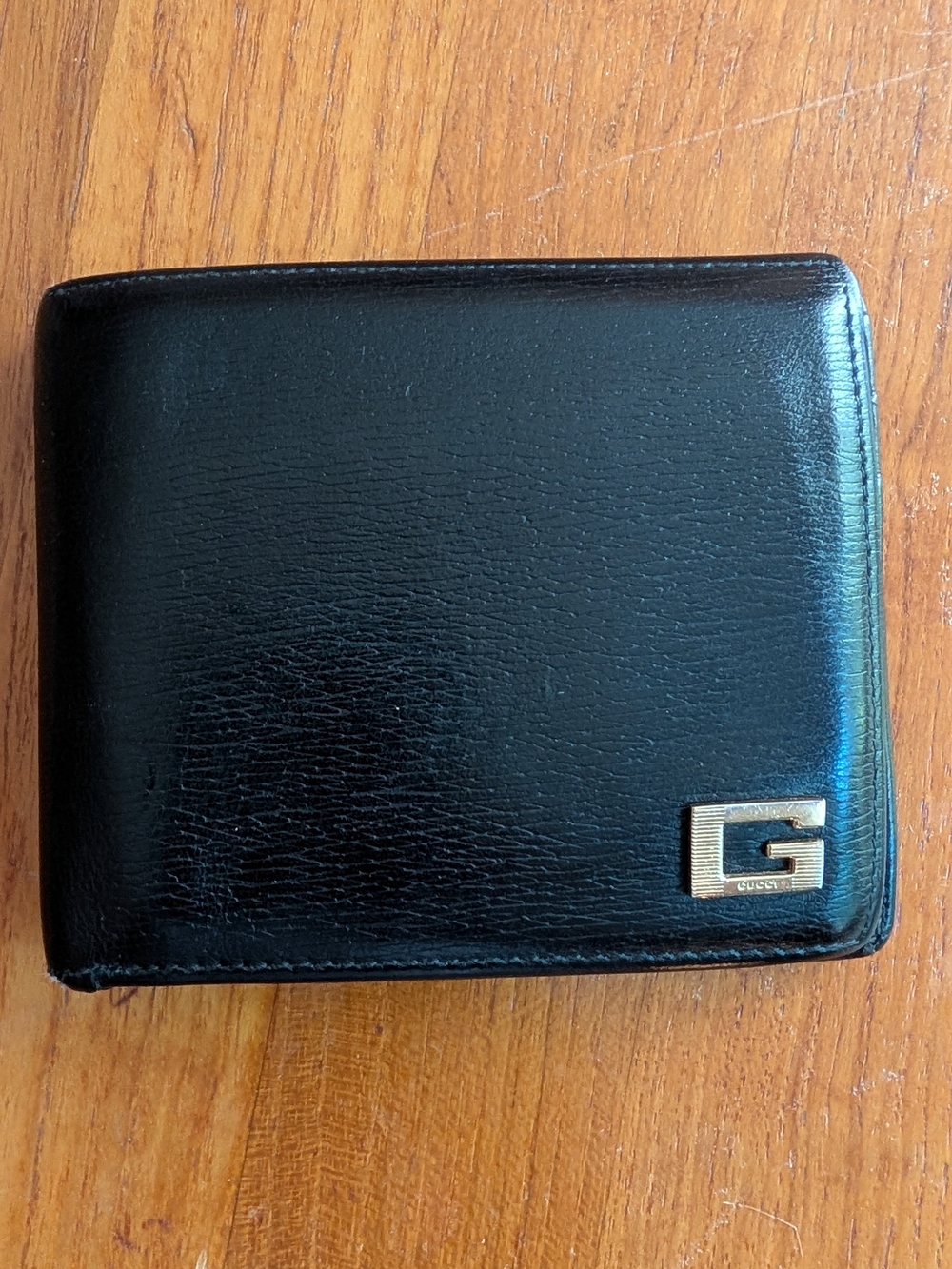 Gucci Black Leather Bifold Wallet with Gold 'G' Emblem